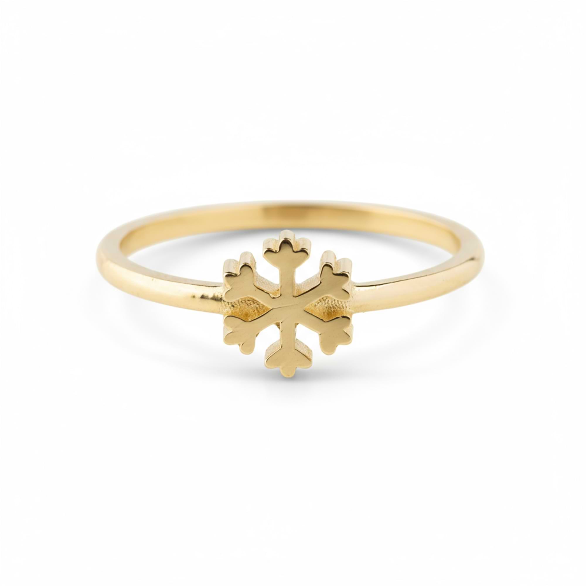 14k Gold ring with a snowflake design on a white background