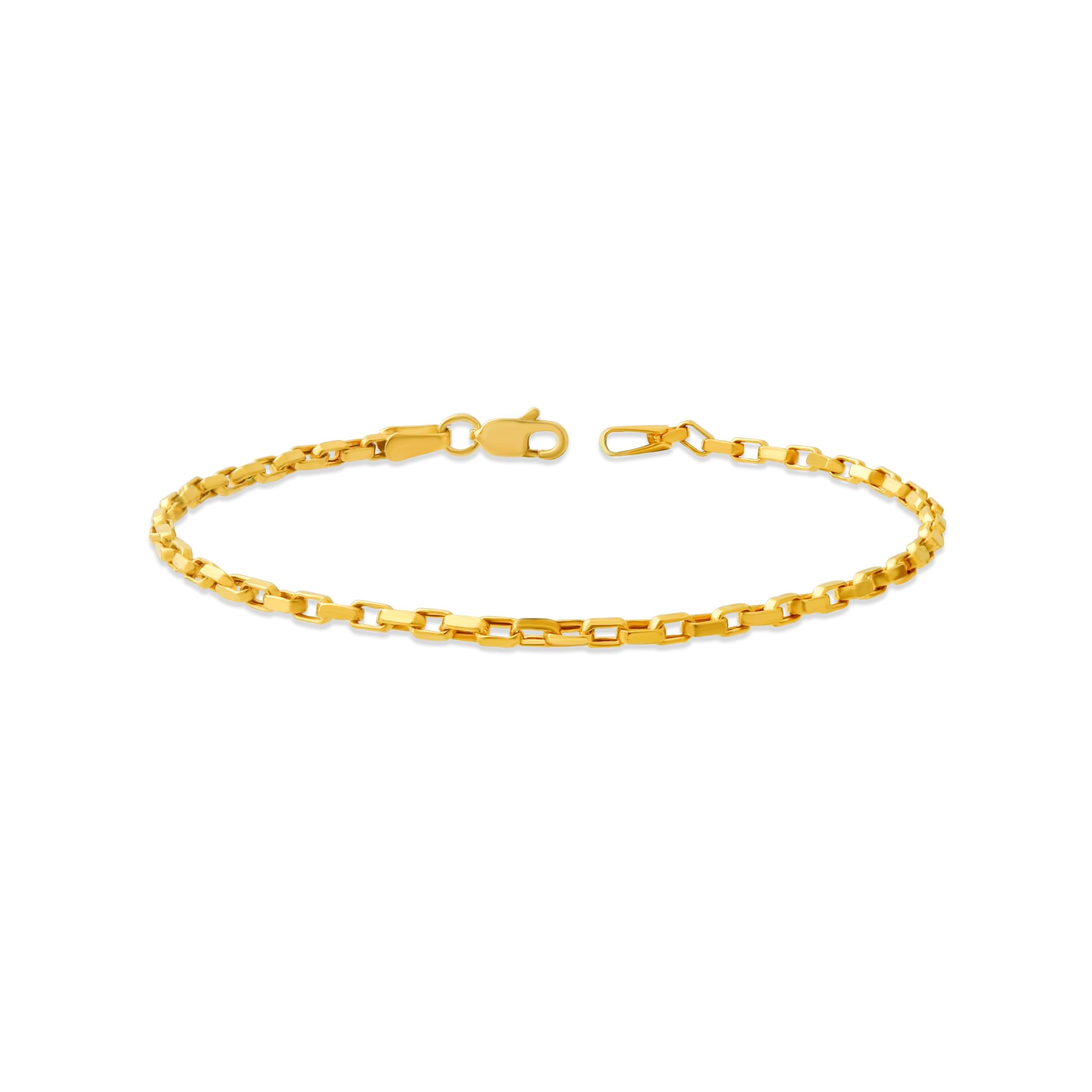Gold 2mm cable chain bracelet on a white background