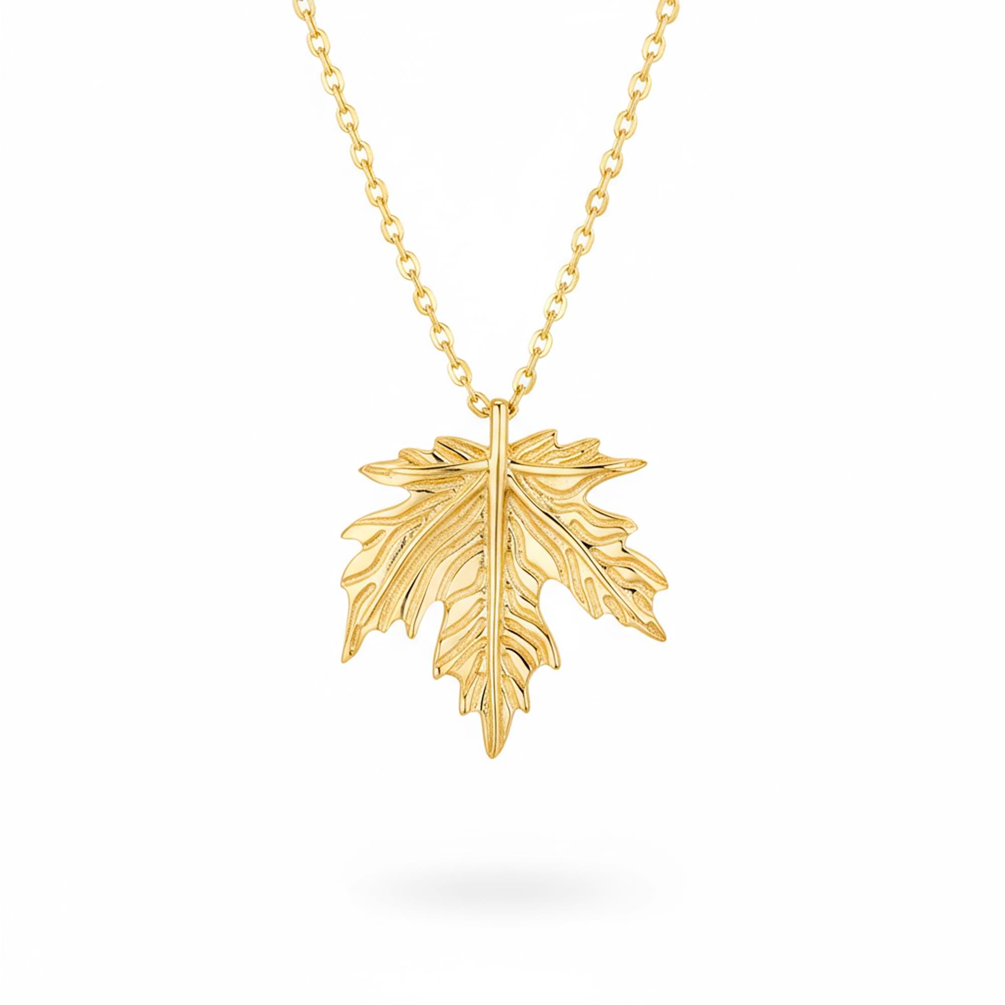 14k Gold leaf pendant necklace on a white background
